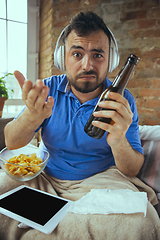 Image showing Lazy man living the whole life in his bed surrounded with messy