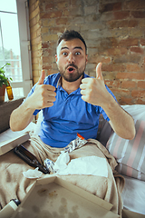 Image showing Lazy man living the whole life in his bed surrounded with messy