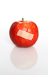 Image showing Injured red apple