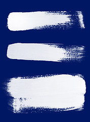 Image showing White brush strokes on blue background