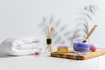 Image showing Beautiful spa composition on massage table in wellness center, copyspace, leaves\' shadow