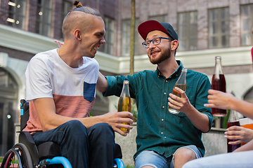 Image showing Two friends taking a stroll on city\'s street in summer day