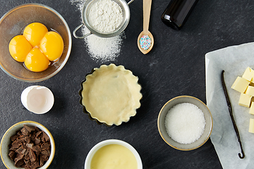 Image showing baking dish with dough and cooking ingredients