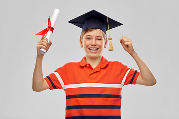 Image showing graduate student boy in mortarboard with diploma