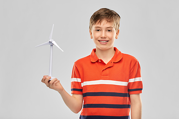 Image showing happy smiling boy holding toy wind turbine