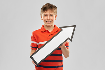 Image showing happy boy holding big white rightwards thick arrow