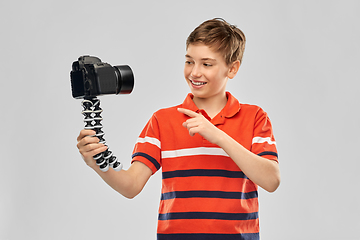 Image showing boy video blogger with camera and tripod