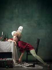 Image showing Young woman as Marie Antoinette on dark background. Retro style, comparison of eras concept.