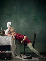 Image showing Young woman as Marie Antoinette on dark background. Retro style, comparison of eras concept.