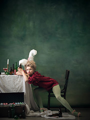 Image showing Young woman as Marie Antoinette on dark background. Retro style, comparison of eras concept.