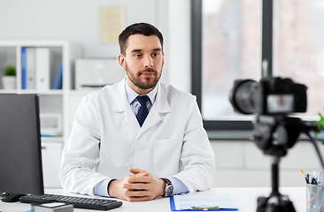 Image showing male doctor recording video blog at hospital