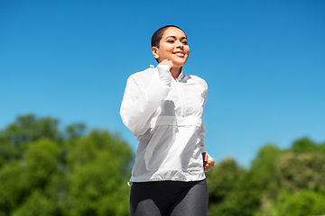 Image showing african american woman running outdoors