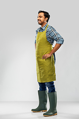 Image showing happy indian male gardener or farmer in apron