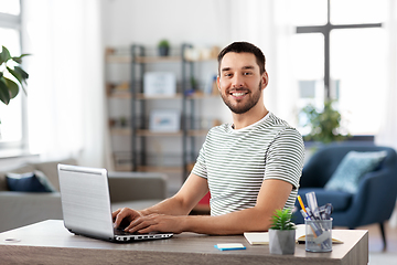 Image showing man with laptop working at home office