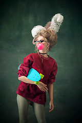 Image showing Young woman as Marie Antoinette on dark background. Retro style, comparison of eras concept.