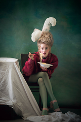 Image showing Young woman as Marie Antoinette on dark background. Retro style, comparison of eras concept.