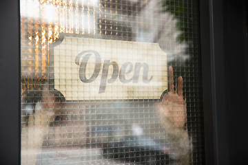 Image showing Open sign on the glass of street cafe or restaurant