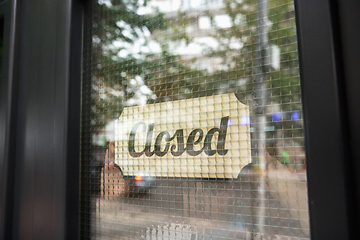 Image showing Closed sign on the glass of street cafe or restaurant