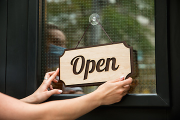 Image showing Open sign on the glass of street cafe or restaurant