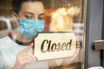 Image showing Closed sign on the glass of street cafe or restaurant