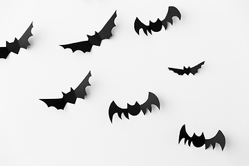 Image showing flock of black paper bats over white background