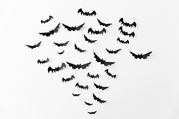 Image showing flock of black paper bats over white background