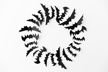 Image showing flock of black paper bats over white background