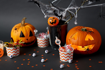 Image showing pumpkins, candies and halloween decorations