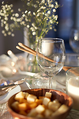 Image showing wine glass on served dinner party table at home