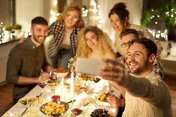 Image showing friends taking selfie at christmas dinner party