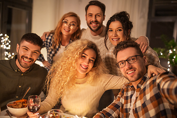 Image showing friends taking selfie at christmas dinner party