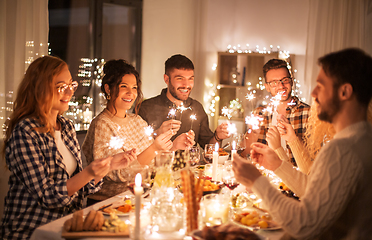 Image showing happy friends having christmas dinner at home