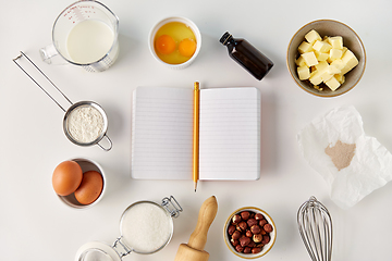 Image showing recipe book and cooking ingredients on table