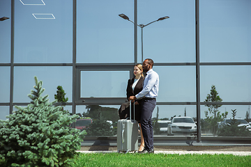 Image showing Meeting of young business partners after arriving to end point of business trip