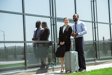 Image showing Meeting of young business partners after arriving to end point of business trip