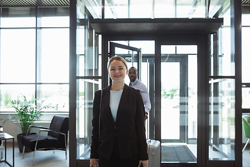 Image showing Meeting of young business partners after arriving to end point of business trip