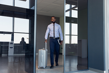 Image showing Young businessman after departure in airport, work trip, business lifestyle