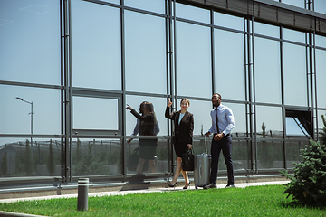 Image showing Meeting of young business partners after arriving to end point of business trip