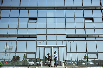 Image showing Meeting of young business partners after arriving to end point of business trip