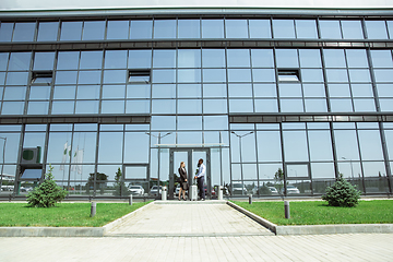 Image showing Meeting of young business partners after arriving to end point of business trip