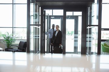 Image showing Meeting of young business partners after arriving to end point of business trip