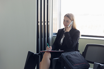 Image showing Young businesswoman before departure. Airport, work trip, business lifestyle