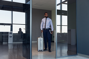 Image showing Young businessman after departure in airport, work trip, business lifestyle