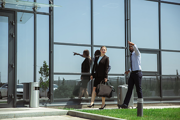 Image showing Meeting of young business partners after arriving to end point of business trip