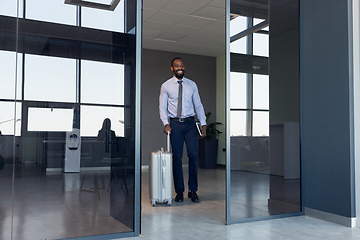 Image showing Young businessman after departure in airport, work trip, business lifestyle