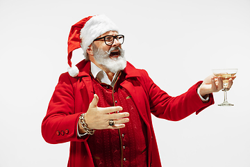 Image showing Modern stylish Santa Claus in red fashionable suit isolated on white background