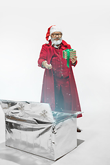 Image showing Modern stylish Santa Claus in red fashionable suit isolated on white background