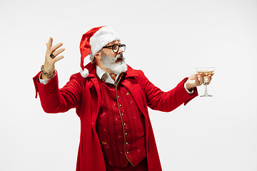 Image showing Modern stylish Santa Claus in red fashionable suit isolated on white background