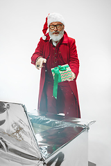 Image showing Modern stylish Santa Claus in red fashionable suit isolated on white background