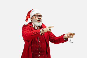 Image showing Modern stylish Santa Claus in red fashionable suit isolated on white background